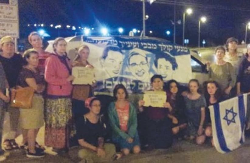 WOMEN AT the Gush Etzion junction show their support for the three kidnapped youths (photo credit: Courtesy)