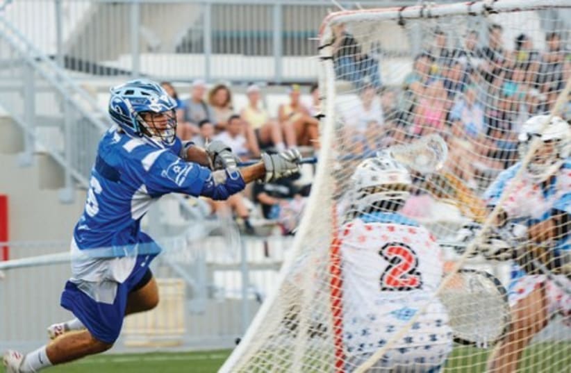 IT WAS a thrilling end-to-end lacrosse match between the Israeli men’s national team (in blue) and the Birthright/USA All-Stars last Wednesday in Ashkelon, with the visitors emerging with a tight 13-12 conquest. Israel is competing in the FIL World Lacrosse Championships next month in Denver (photo credit: SPORTPIC/COURTESY)