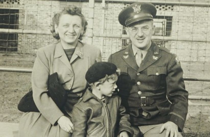A young David Geffen (center) poses with his mother and father at a military base in Mississippi. (photo credit: AVIE GEFFEN PICTORIAL ARCHIVES)