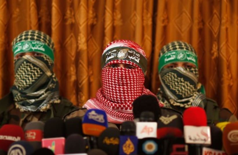 Hamas' armed wing spokesman speaks during a news conference in Gaza City July 3, 2014. (photo credit: REUTERS)