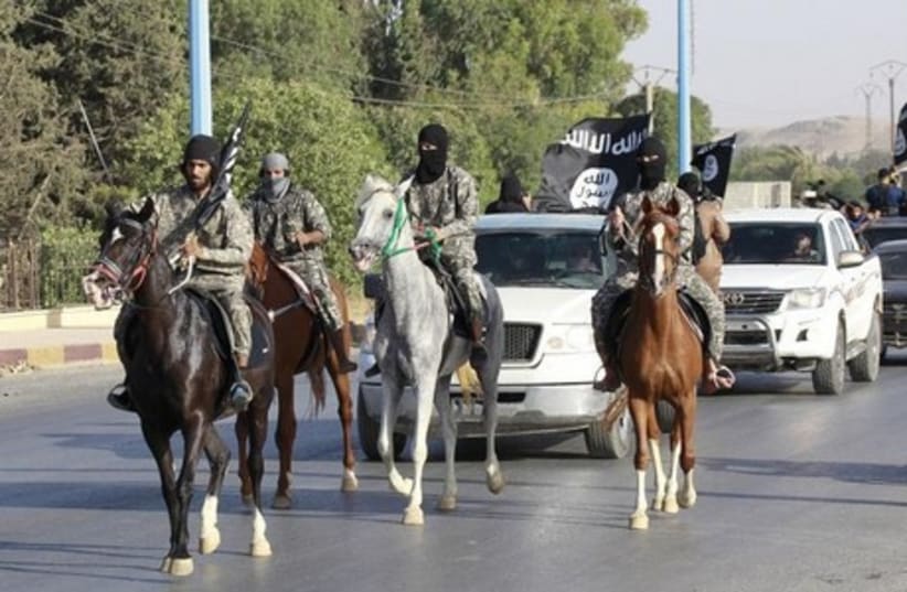 Militants from "Caliphate" The Islamic State  (photo credit: REUTERS)