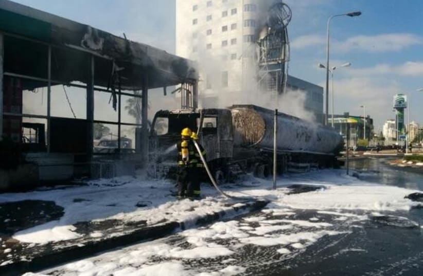 Scene of fire caused by rocket that struck next to Ashdod gas station, July 11, 2014. (photo credit: ISRAEL POLICE)