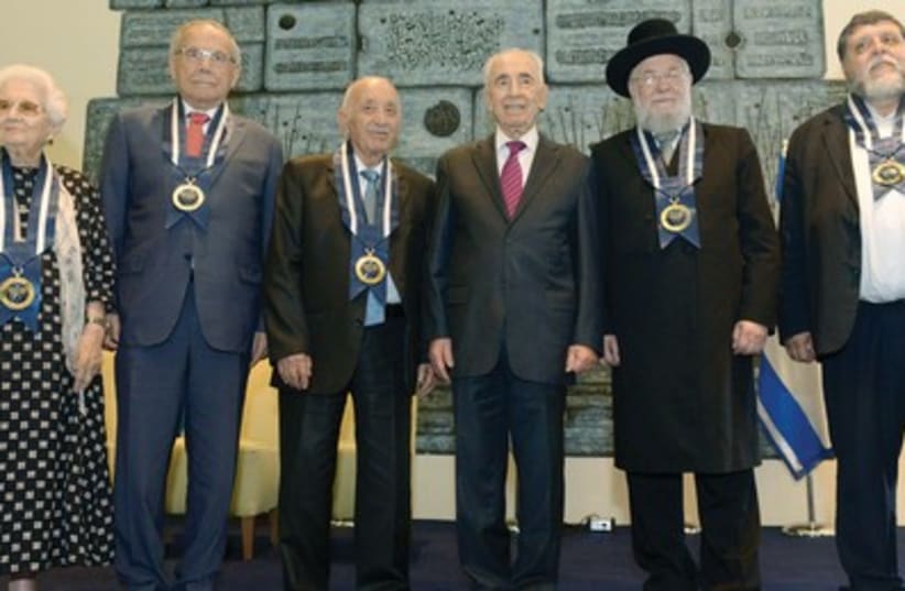 PRESIDENT SHIMON PERES stands with, from left, Ruth Dayan, Stef Wertheimer, Kamal Mansour, Rabbi Israel Meir Lau and Rabbi Rafi Feuerstein at his residence in the capital yesterday. (photo credit: Mark Neiman/GPO)