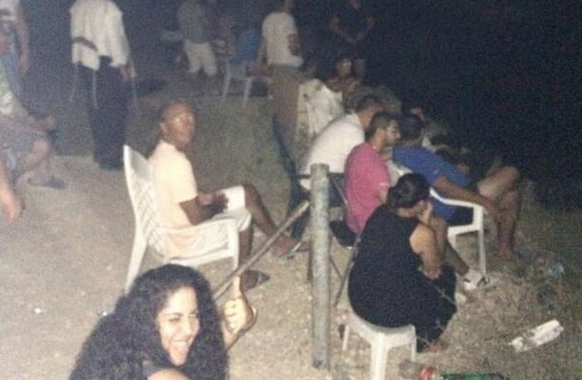 Israeli residents of Sderot seen watching the bombardment of Gaza. (photo credit: TWITTER)