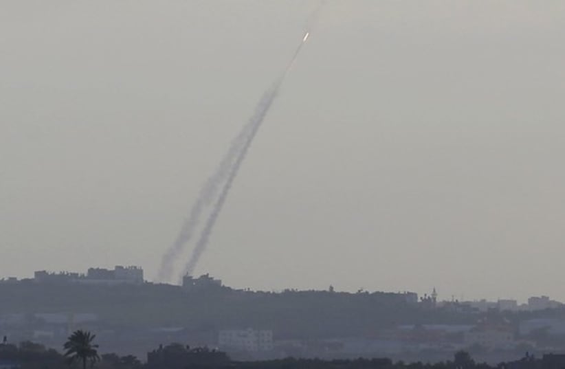 Smoke trails are seen as a rocket is launched from the northern Gaza Strip towards Israel (photo credit: REUTERS)
