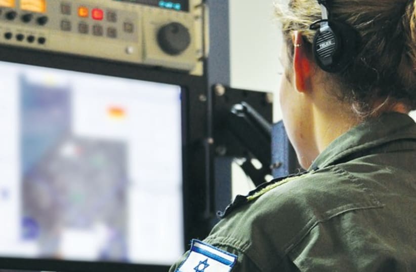 An officer monitors intelligence from Gaza in IAF headquarters. (photo credit: HAGAR AMIBAR)