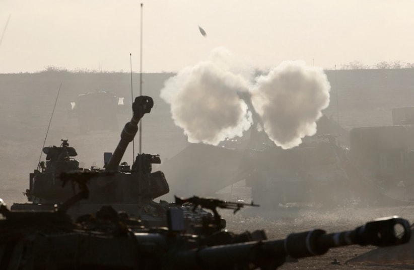 An Israeli mobile artillery unit fires towards Gaza from outside the northern Gaza Strip (photo credit: REUTERS)