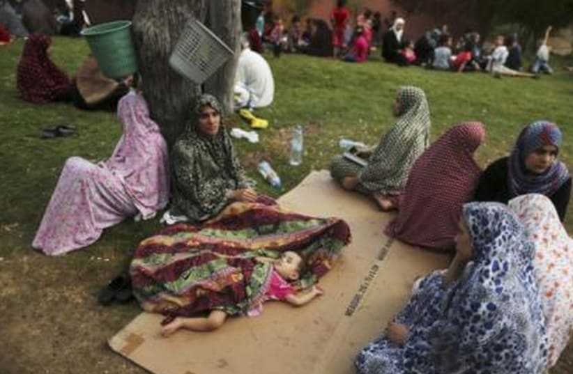 Palestinian women in Gaza who fled their homes (photo credit: REUTERS)