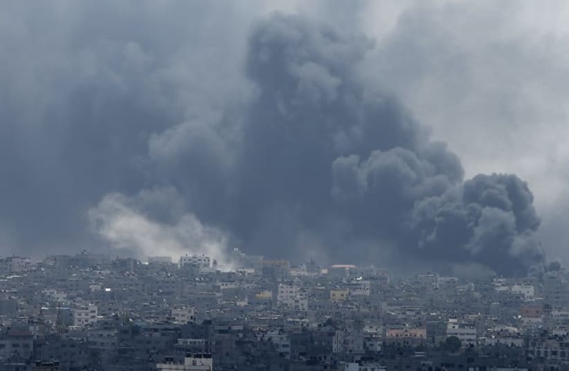 Smoke rises during what witnesses said were heavy Israeli shelling at the Shejaia neighbourhood in Gaza City (photo credit: REUTERS)