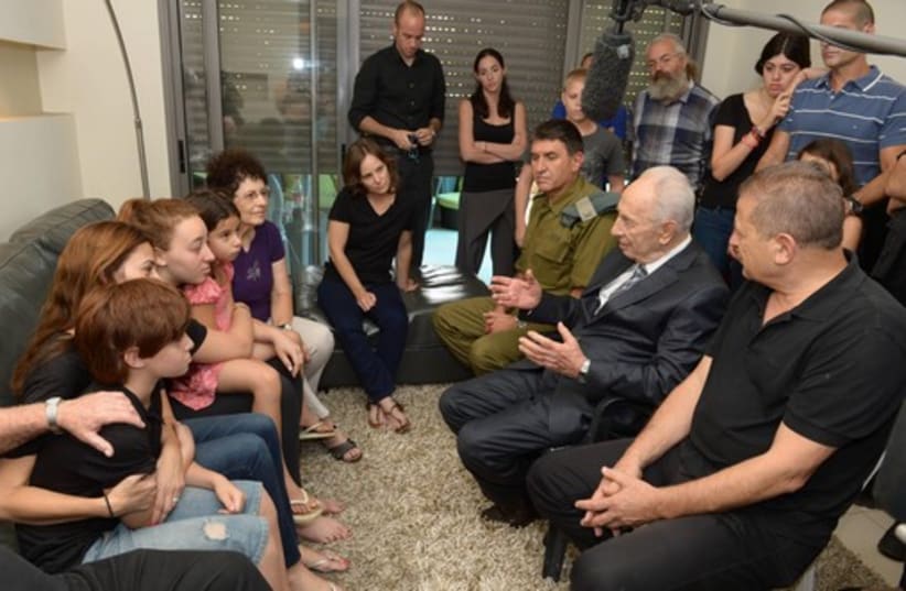 President Peres visiting families of fallen IDF soldiers (photo credit: Mark Neiman/GPO)