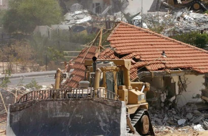 Israeli bulldozers demolish homes in the Neve Dekalim settlement in the Gaza Strip, August 31, 2005 (photo credit: MOTI MILROD / REUTERS)