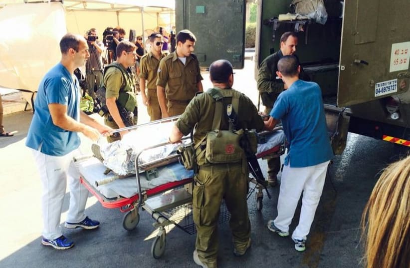 Wounded soldiers arrive at Soroka Medical Center in Beersheba (photo credit: MARC ISRAEL SELLEM/THE JERUSALEM POST)