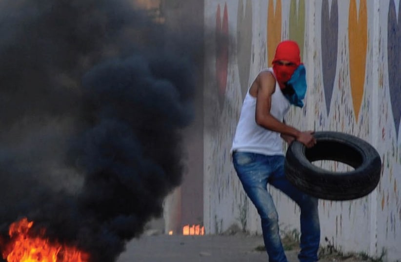 Israeli Arabs clash with border police during rioting in Wadi Ara (photo credit: IZIK BARBI / FLASH 90)