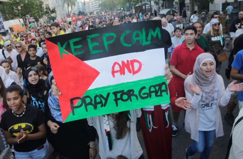 People protest against Israel's military action in Gaza during a demonstration in Valencia, July 21, 2014.  (photo credit: REUTERS)