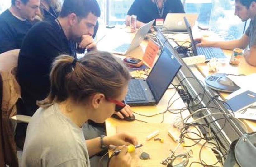 PARTICIPANTS IN the Israel Tech Challenge work during the 36-hour hackathon in Tel Aviv this week (photo credit: ISRAEL TECH CHALLENGE)