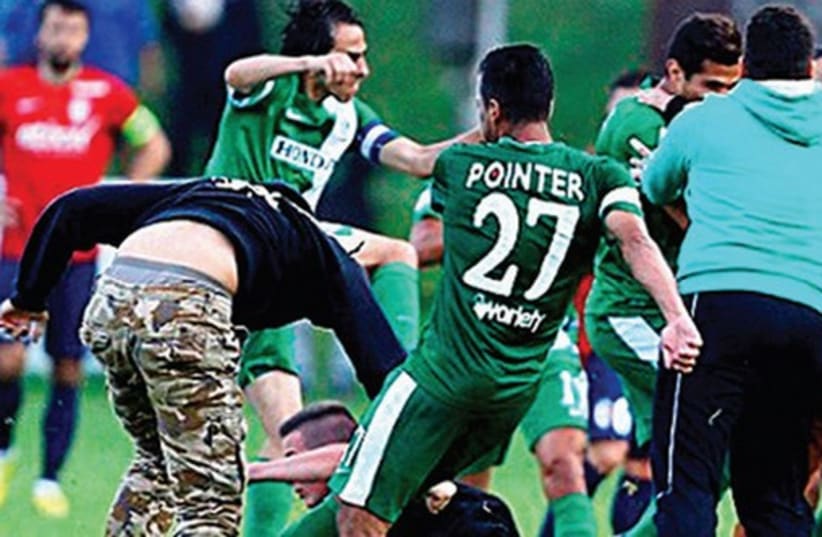 Maccabi Haifa teammates were forced to fight for their safety after being attacked by a mob of pro-Palestinian protesters Wednesday in Austria. (photo credit: MACCABI HAIFA WEBSITE)