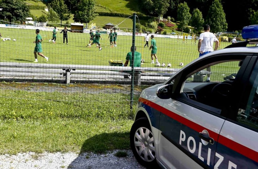 A police car is seen during a training session of Maccabi Haifa in the Austrian village of Leogang on Friday. (photo credit: REUTERS)