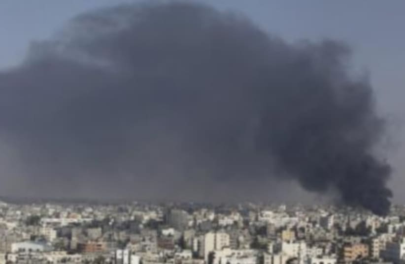 Smoke rises following what witnesses said was an IAF air strike in the east of Gaza City. (photo credit: REUTERS)