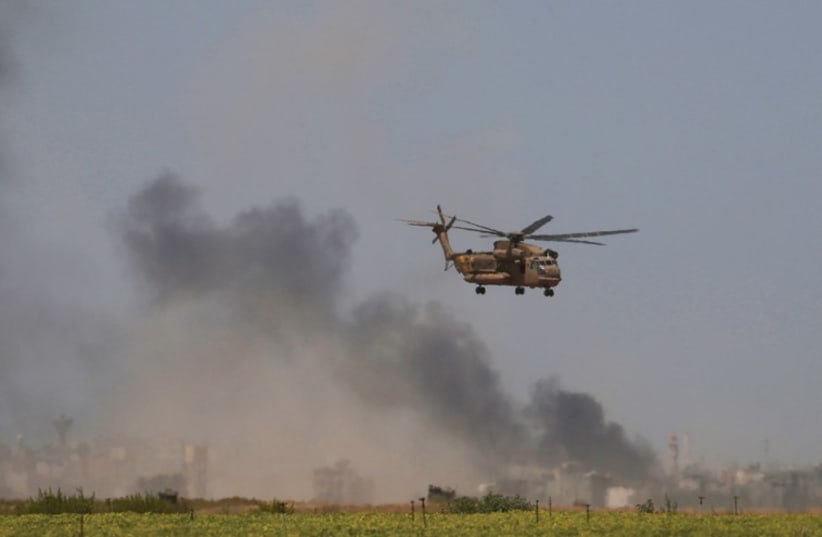 A HELICOPTER evacuates wounded from Gaza to a hospital. (photo credit: REUTERS)
