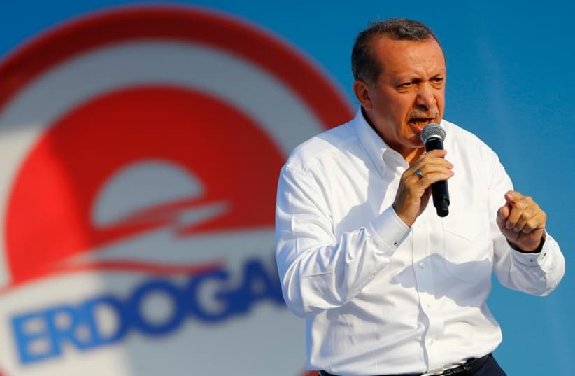 Turkey's Prime Minister and presidential candidate Tayyip Erdogan addresses his supporters during an election rally in Istanbul August 3, 2014. (photo credit: REUTERS)