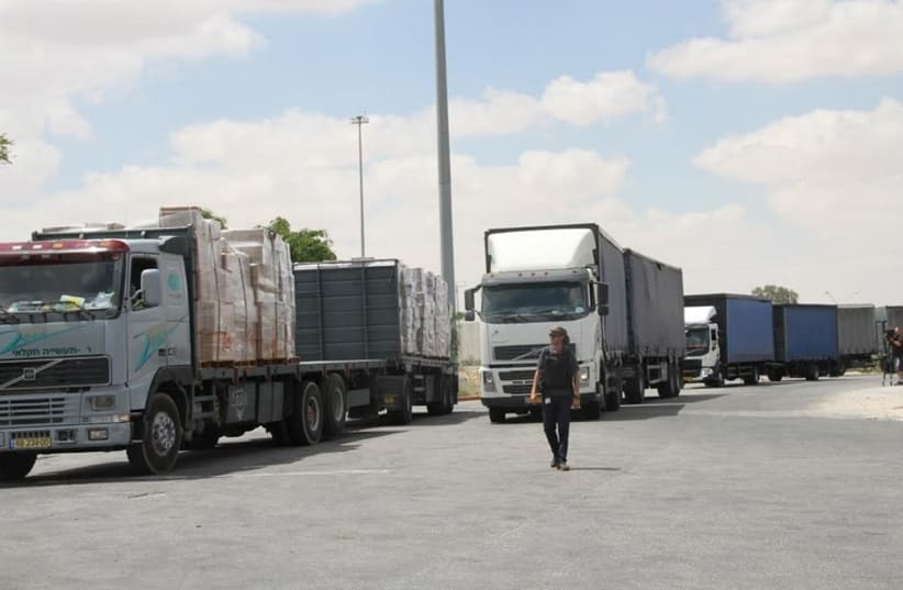 ISRAELI TRUCKS head into the Kerem Shalom crossing point yesterday with goods bound for the Gaza Strip (photo credit: TOVAH LAZAROFF)