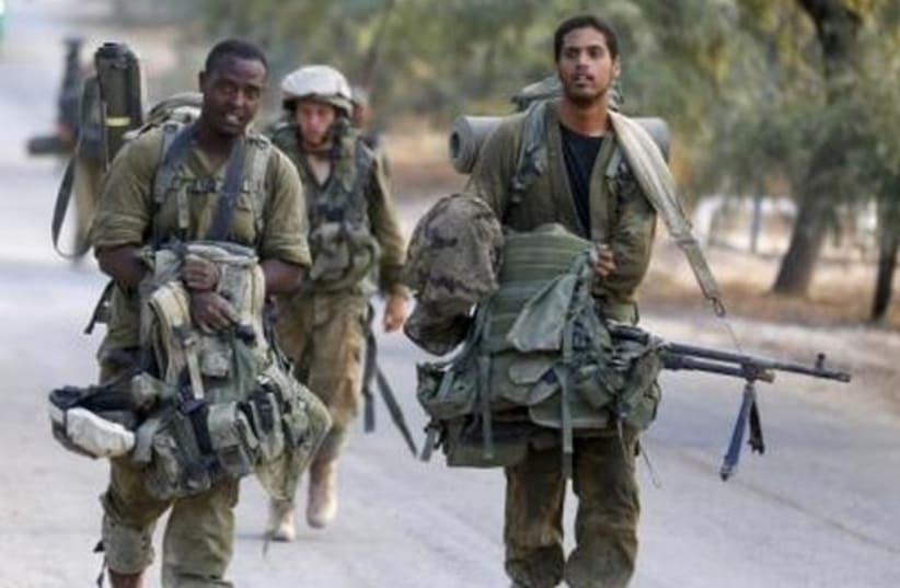 IDF soldiers after returning to Israel from Gaza August 5, 2014. (photo credit: REUTERS)