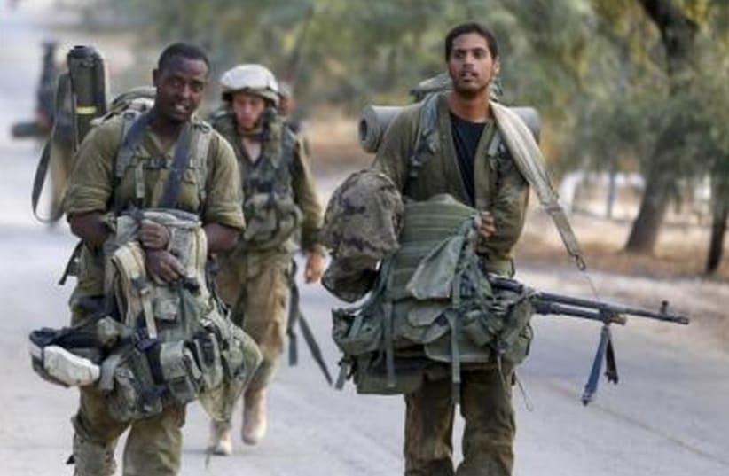 IDF soldiers after returning to Israel from Gaza August 5, 2014. (photo credit: REUTERS)