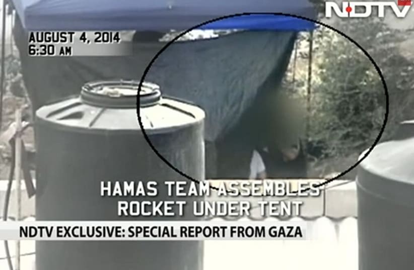 NDTV report of Palestinians assembling rockets in Gaza. (photo credit: YOUTUBE SCREENSHOT)