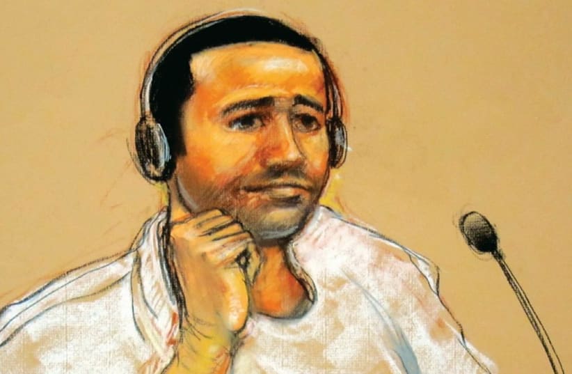 COURTROOM SKETCH of the military trial in Guantanamo Bay of an al-Qaida chieftain as he watches court proceedings in November 2011 (photo credit: REUTERS)