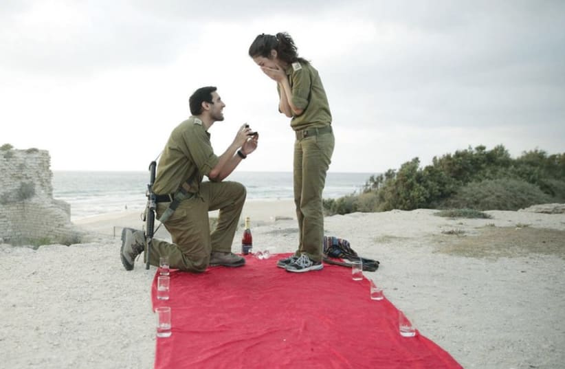 The photo of Itai Hoffman proposing to Ilana Sherrington went viral on the Facebook page of the Israel advocacy group StandWithUS. (photo credit: COURTESY ILANA SHERRINGTON)