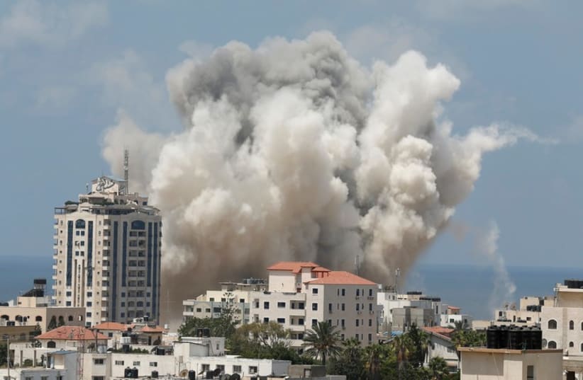 Smoke rises following what witnesses said was an Israeli air strike in Gaza City August 9 (photo credit: REUTERS)