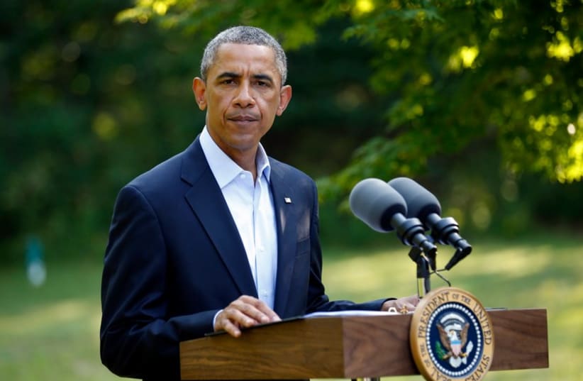 US President Barack Obama delivers a statement on the situation in Iraq from his vacation home at Martha's Vineyard, Massachusetts. (photo credit: REUTERS)