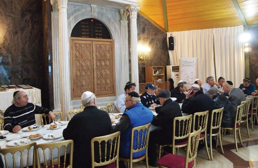 Turkish Jews eating breakfast in an Istanbul synagogue (photo credit: SAM SOKOL)