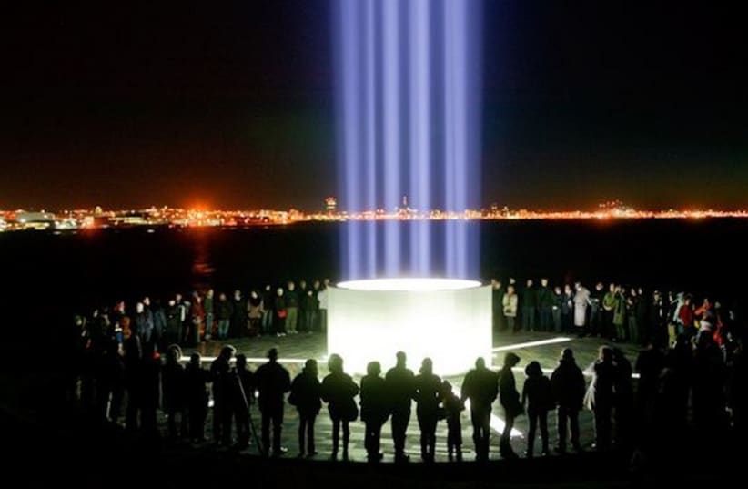 The Imagine Peace Tower lit in the hopes of bringing peace to the Israeli-Arab conflict (photo credit: GRAY LINE ICELAND)