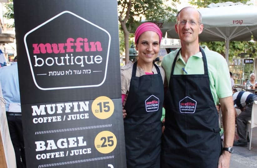 Shmarya and Lainie Richler stand outside their new downtown cafe, Muffin Boutique. (photo credit: Courtesy)