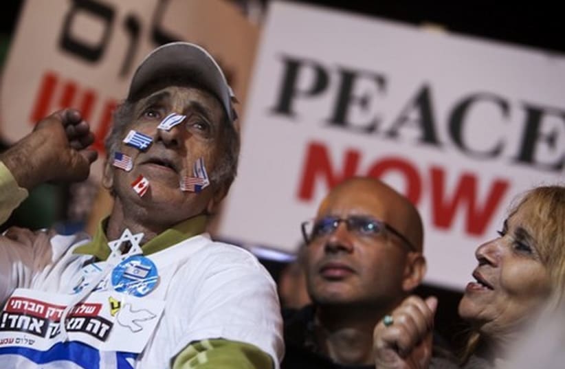 Israelis attend a pro-peace rally in Tel Aviv. (photo credit: REUTERS)