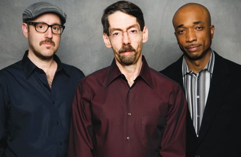 Jazz pianist Fred Hersch (middle) seen here with trio members John Hébert (left) and Eric McPherson. (photo credit: MATTHEW RODGERS)