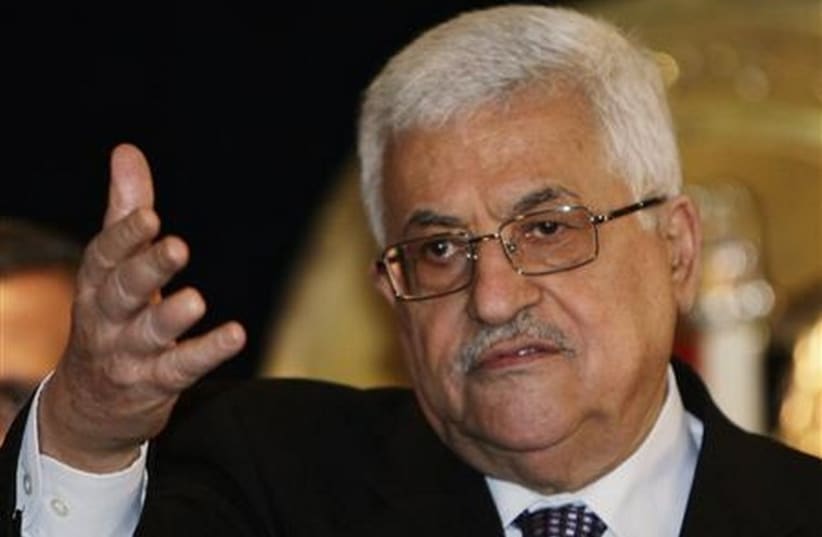 Palestinian Authority President Mahmoud Abbas talks during a news conference in Egypt (photo credit: REUTERS)