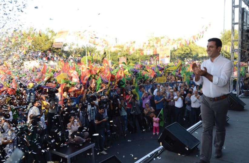 Presidential candidate SELAHATTIN DEMIRTAS speaks during an election rally in Diyarbakir, days before he lost the Turkish election  (photo credit: REUTERS)