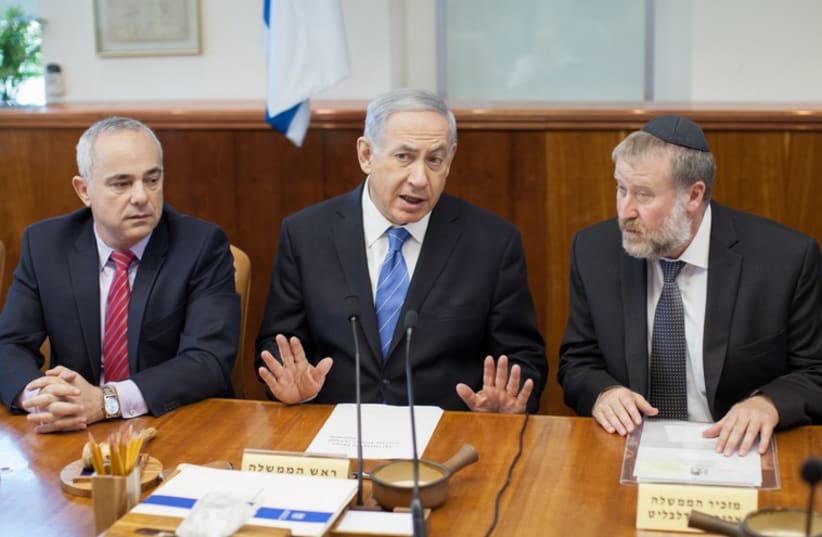 Netanyahu at cabinet meeting (photo credit: EMIL SALMAN/POOL)