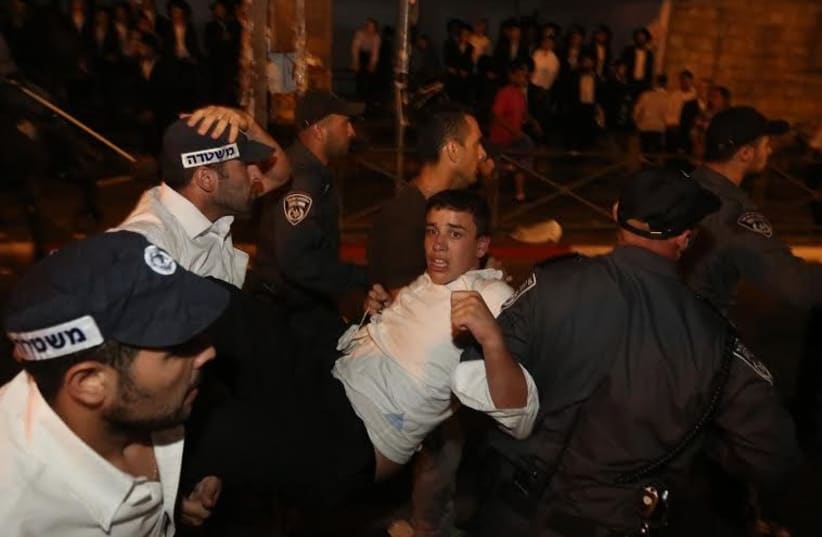 Haredi protester arrested, Jerusalem, August 17, 2014 (photo credit: MARC ISRAEL SELLEM)
