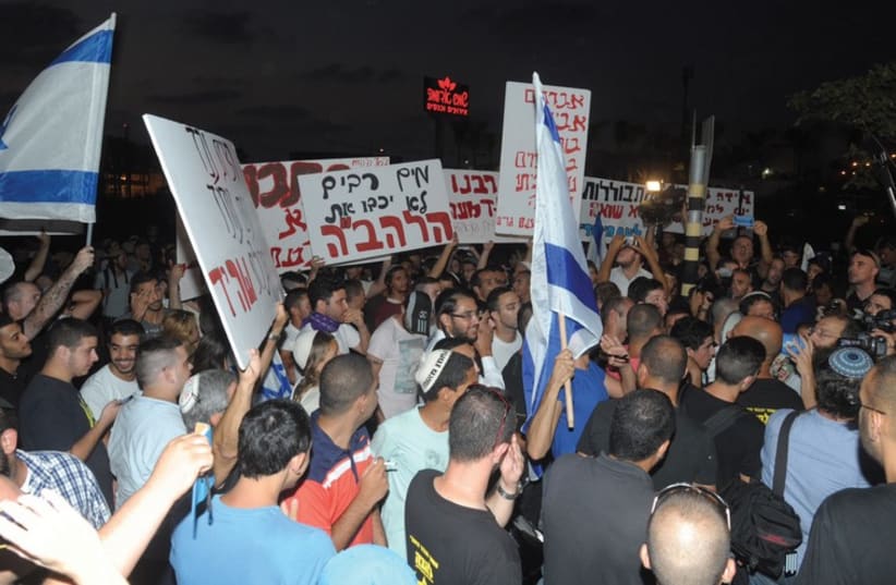 Protest against Arab man and a Jewish-born woman (photo credit: AVSHALOM SASSONI)