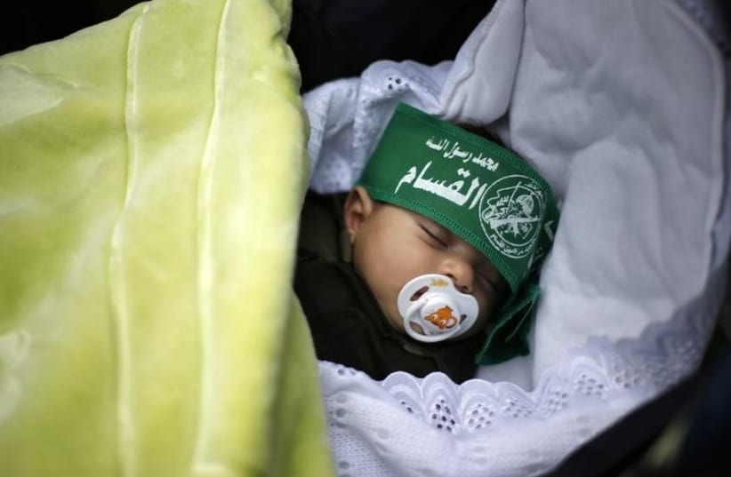A Palestinian baby wearing a Hamas headband. (photo credit: REUTERS)