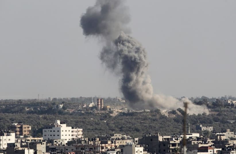 Smoke rises following Israeli air strike in Gaza August 19 (photo credit: REUTERS)