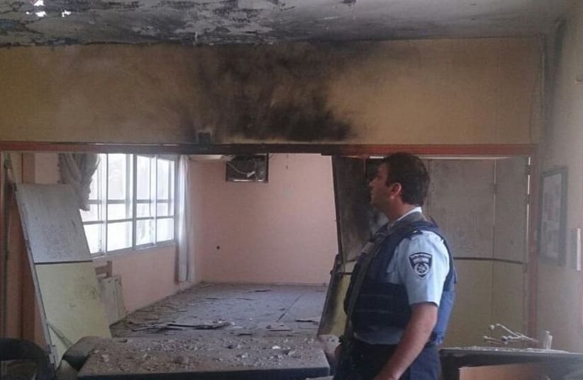 Police surveying damage of building in Eshkol, August 21, 2014. (photo credit: ISRAEL POLICE)