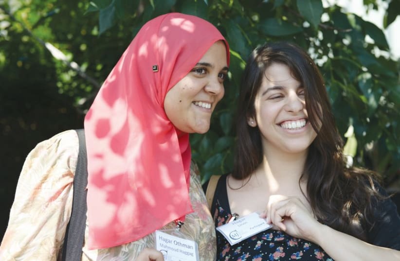 Hagar Haggag (left), from Egypt, and Hagar Levin, from Israel, show their matching name tags at the Muslim Jewish Conference in Vienna last week. (photo credit: DANIEL SHAKED)