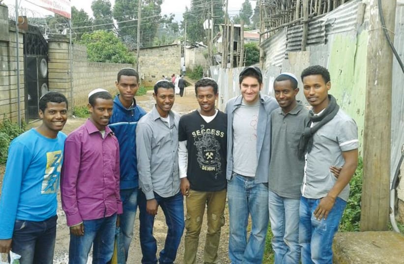 Uri Perednik poses with Ethiopian Jews in Addis Ababa. (photo credit: Courtesy)