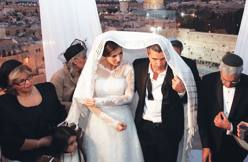 A Jewish couple weds in Jerusalem.  (photo credit: MARC ISRAEL SELLEM/THE JERUSALEM POST)