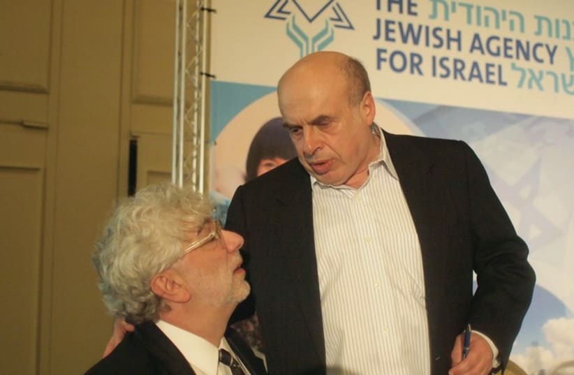 NATAN SHARANSKY talks to Misha Galperin, chief JAFI fundraiser at a Board of Governors meeting in Tel Aviv earlier this year.  (photo credit: SAM SOKOL)