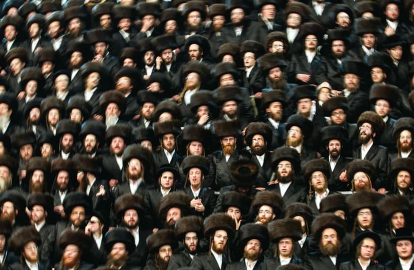 Ultra orthodox Jews wear shtreimels to a traditional religious wedding ceremony in Jerusalem. (photo credit: REUTERS)